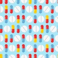 Colorful pills seamless pattern. Vector background. Seamless texture realistic tablets on blue background Royalty Free Stock Photo